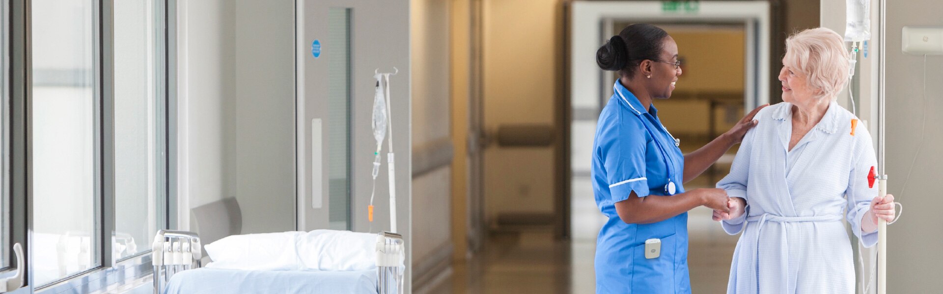 nurse embracing patient in hospital setting